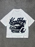 A white short-sleeve t-shirt with a black graphic print featuring the text 'Kool Fly' and a women's mouth design, laid flat on a gray textured background.